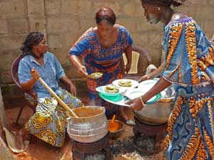 Togo women cooking lunch